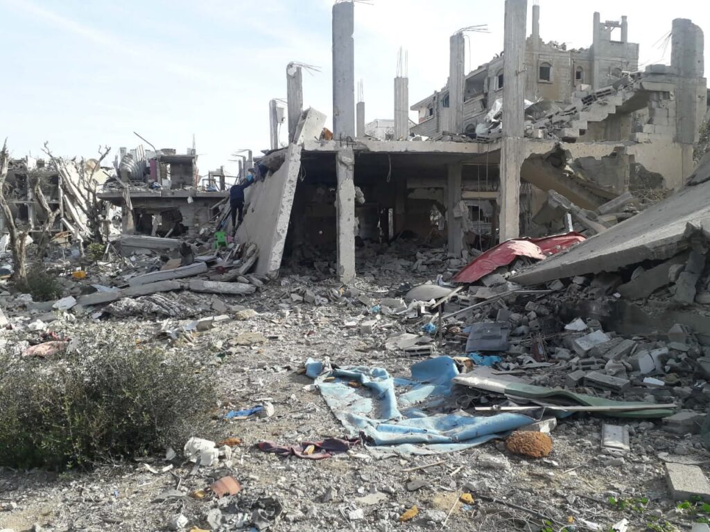 The remains of Rahaf’s family home in Gaza, reduced to a skeletal concrete building and rubble.